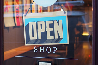 thumbnail-ecommerce glass door with an open sign hanging from it